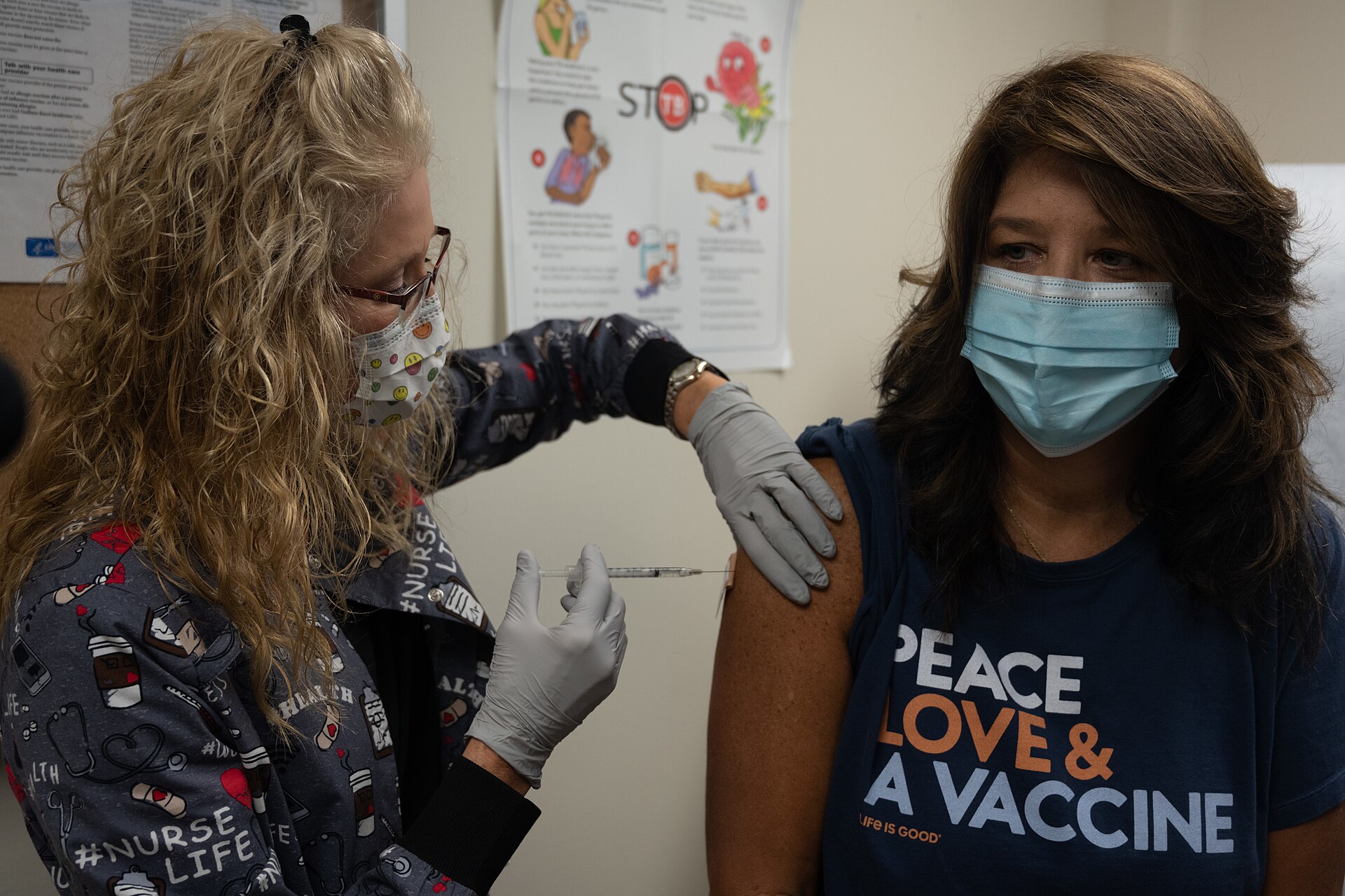 A healthcare worker preparing a measles vaccination dose at a clinic